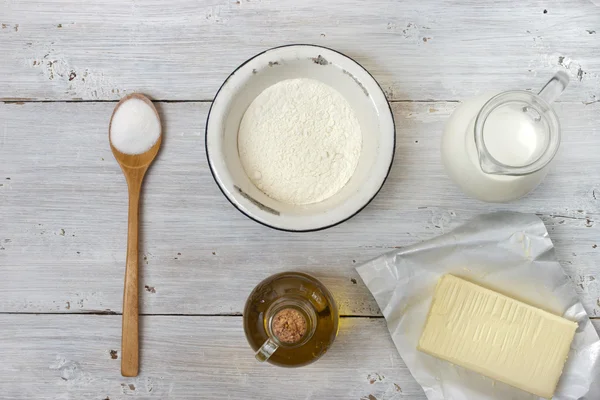 Ingredients for the pancakes on the white table around the parch — Stock Photo, Image