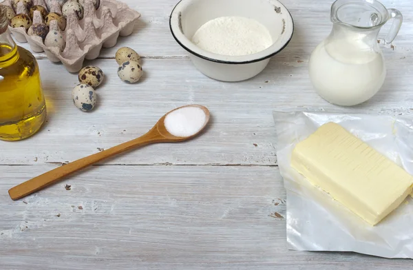 Ingredients for the pancakes on the white table around the parch — Stock Photo, Image