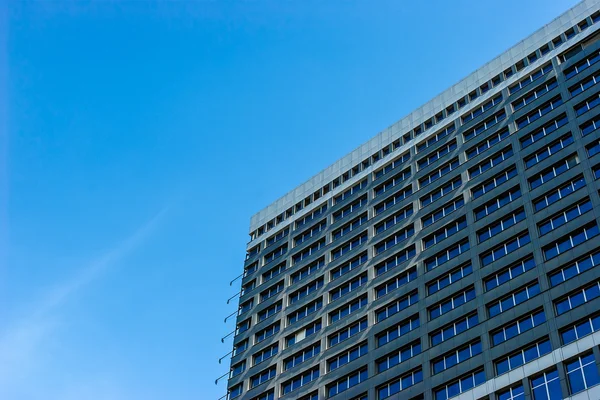 Modern building facade on the blue sky background — Stock Photo, Image