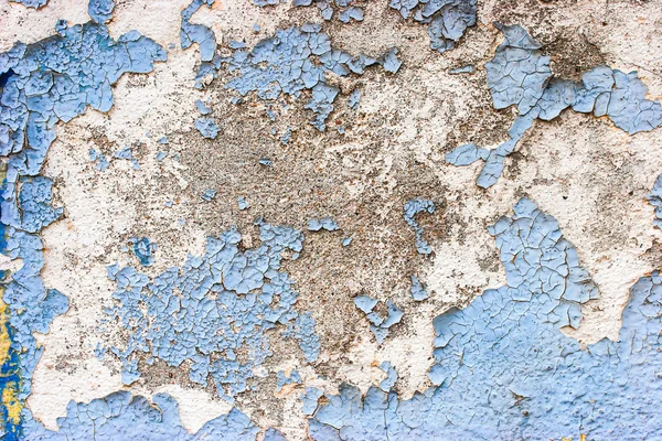 Old stone wall with cracked blue color paint background — Stock Photo, Image