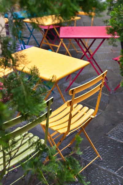 Colorful chairs in a street cafe — Stock Photo, Image