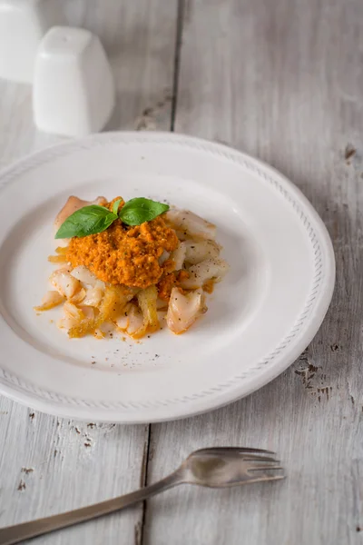 Cod with vegetable sauce on the white wooden table — Stock Photo, Image