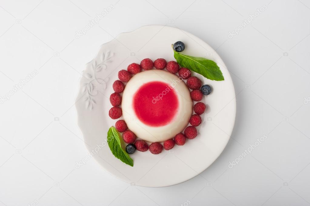 Panna cotta with berries and mint top view