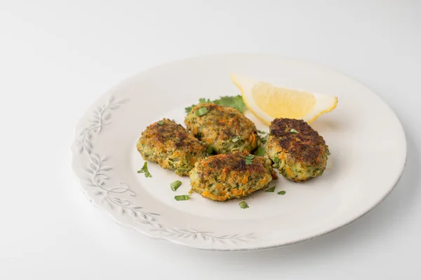 Rissoles with carrot and greens on the white background — 图库照片