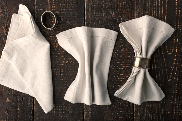 Set of the napkins with vintage rings on the wooden table horizontal — Φωτογραφία Αρχείου