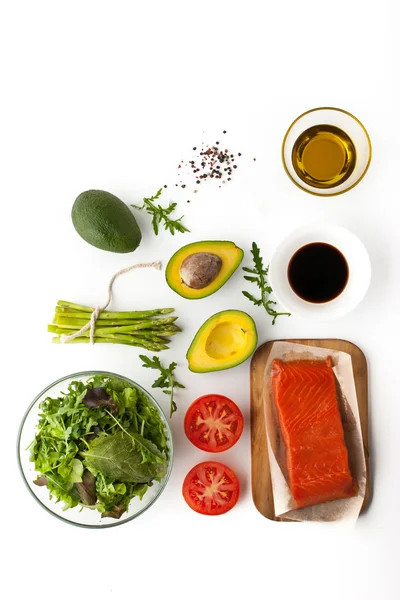 Ingredients for avocado and trout salad on the white background top view — Stock Photo, Image