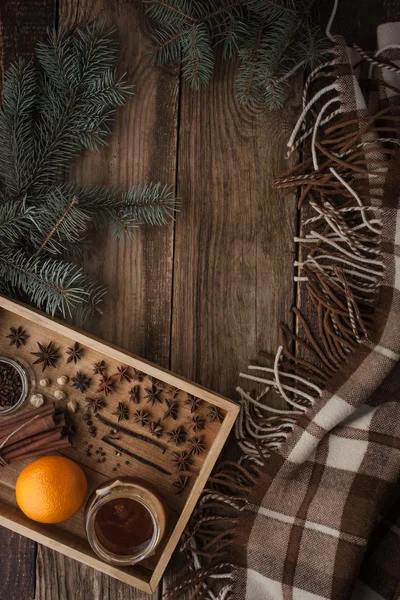 Orange , honey and spices on the wooden tray with plaid vertical — Stock Photo, Image