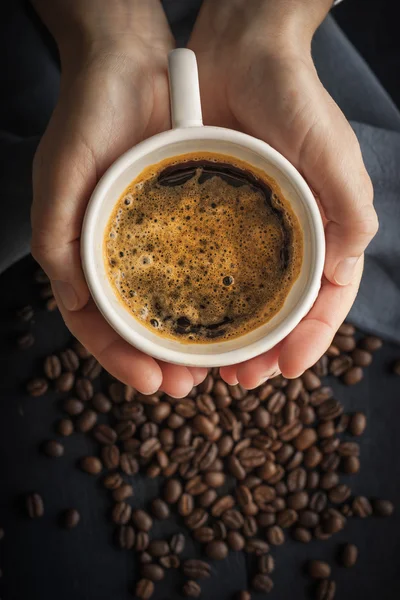 Cup of coffee in the hands vertical — Stock Photo, Image