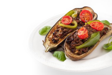 Eggplant with minced meat and vegetables on the white background horizontal