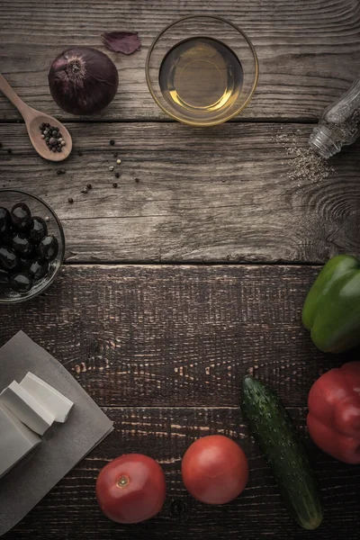 Ingredients for Greek salad on the wooden table — Stock Photo, Image