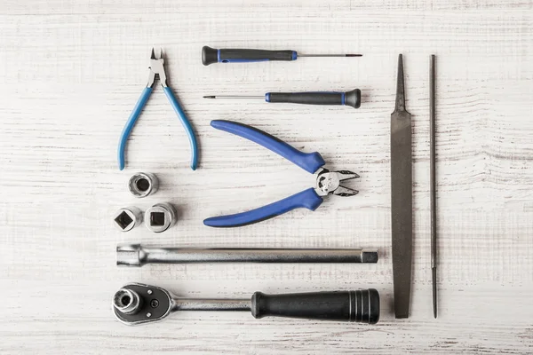 Instruments working on a wooden table — Stock Photo, Image