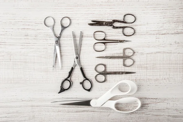 Set of scissors on a wooden table — Stock Photo, Image