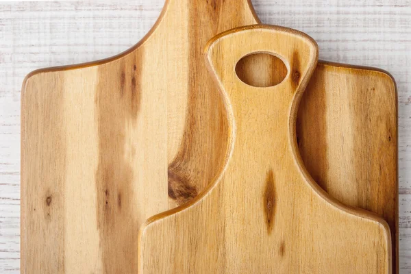 Kitchen boards on the white table top view — Stock Photo, Image