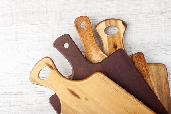 Kitchen boards set  on the white table  top view — Stock Photo, Image
