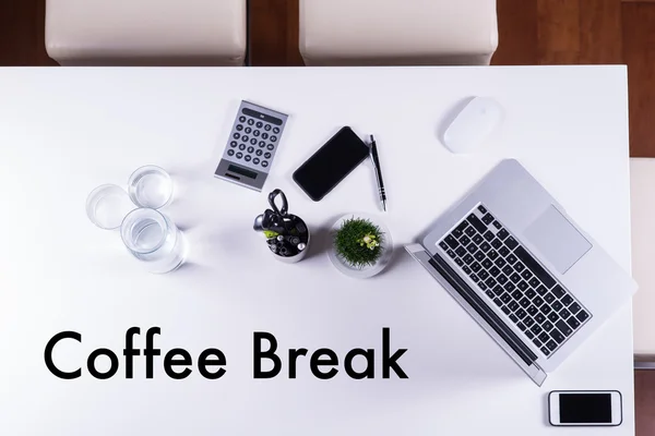 Coffee break on empty meeting table as symbol — Stock Photo, Image