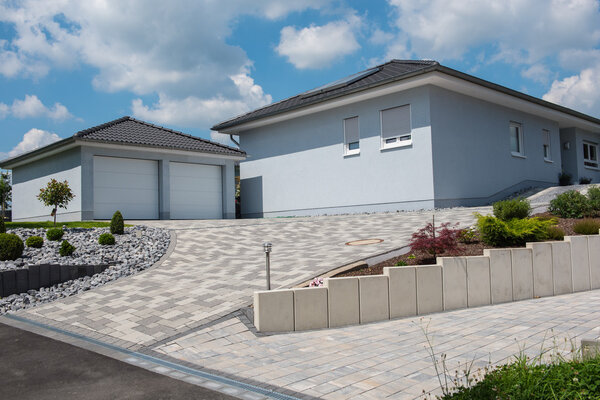 beautiful light blue prefabricated house with double garage