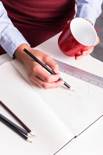 View from the top - an female engineer drawing — Stock Photo, Image