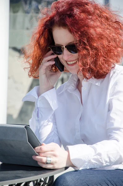 Portrait of a red haired woman outdoors — Stock Photo, Image