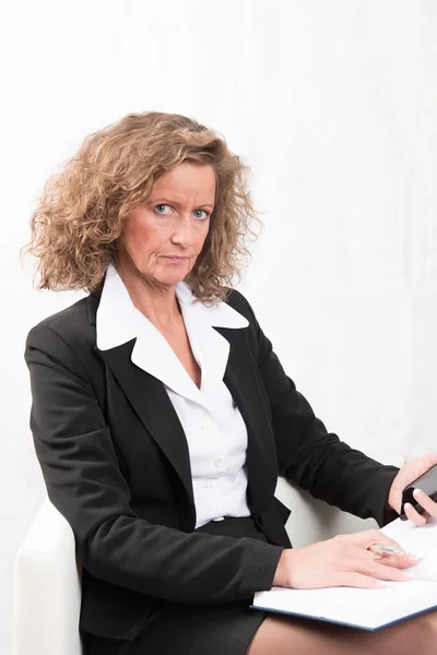 Female Boss with calendar and smartphone — Stock Photo, Image