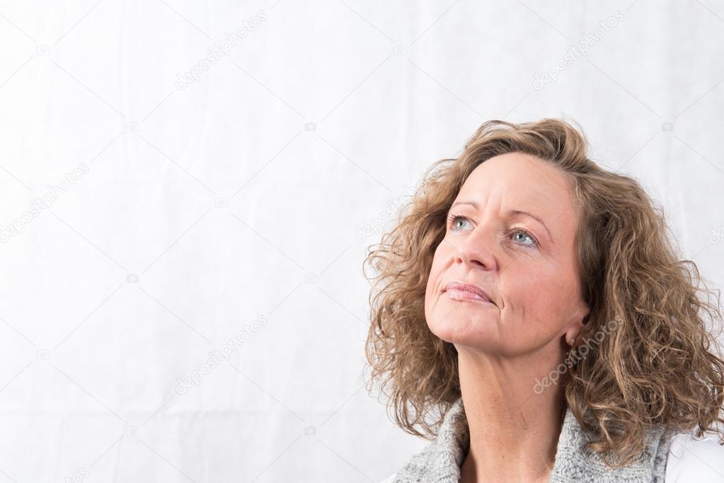 Portrait strong, smiling woman looking above