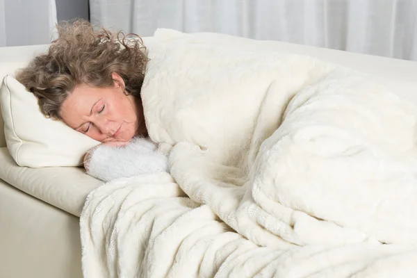 Woman sleeping on couch — Stock Photo, Image