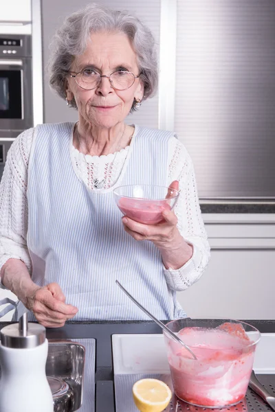 active female  senior in kitchen