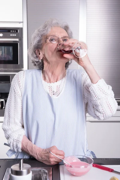 active female  senior in kitchen