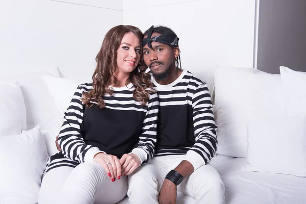 Couple in love sitting on couch — Stock Photo, Image