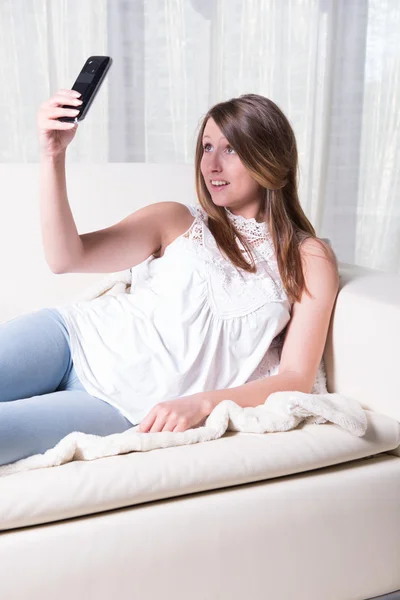 Attractive young girl shooting selfie — Stock Photo, Image