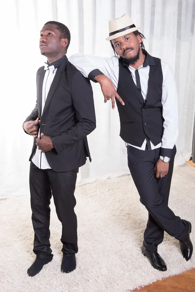 Two african guys posing on a carpet — Stock Photo, Image