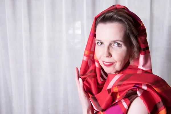 Portrait attractive woman with scarf around her head — Stock Photo, Image