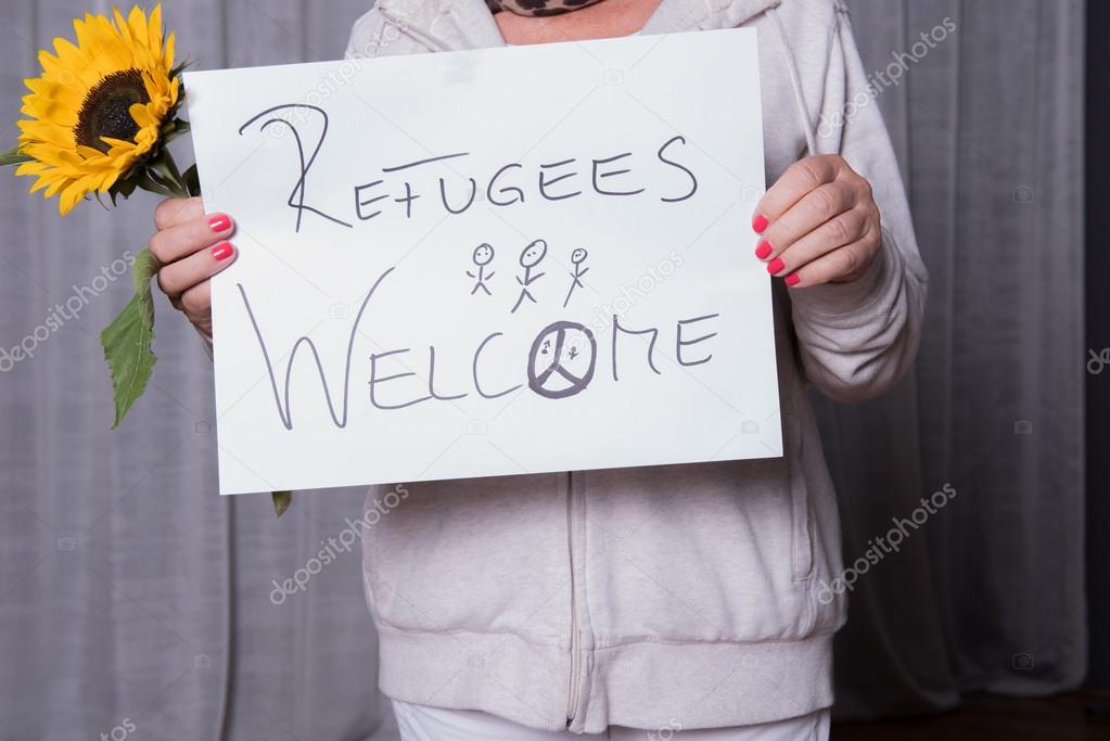female helper welcomes refugees