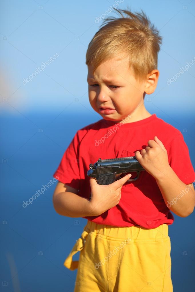 depositphotos_60134865-stock-photo-crying-boy-with-a-gun.jpg