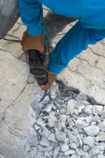 Road repairing works with jackhammer — Stock Photo, Image