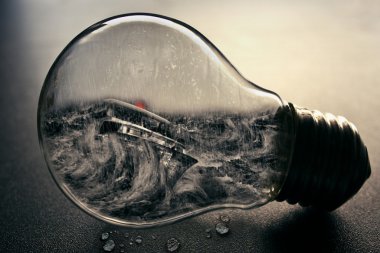 light bulb with ship and sea inside