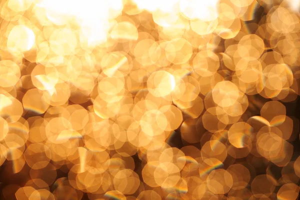 闪闪发亮的节日圣诞节灯光背景。光和黄金东富 — 图库照片
