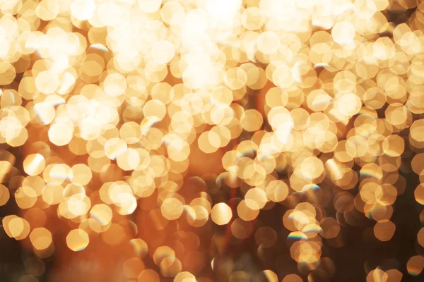 Třpytky slavnostní vánoční osvětlení pozadí. světlo a zlaté defo — Stock fotografie