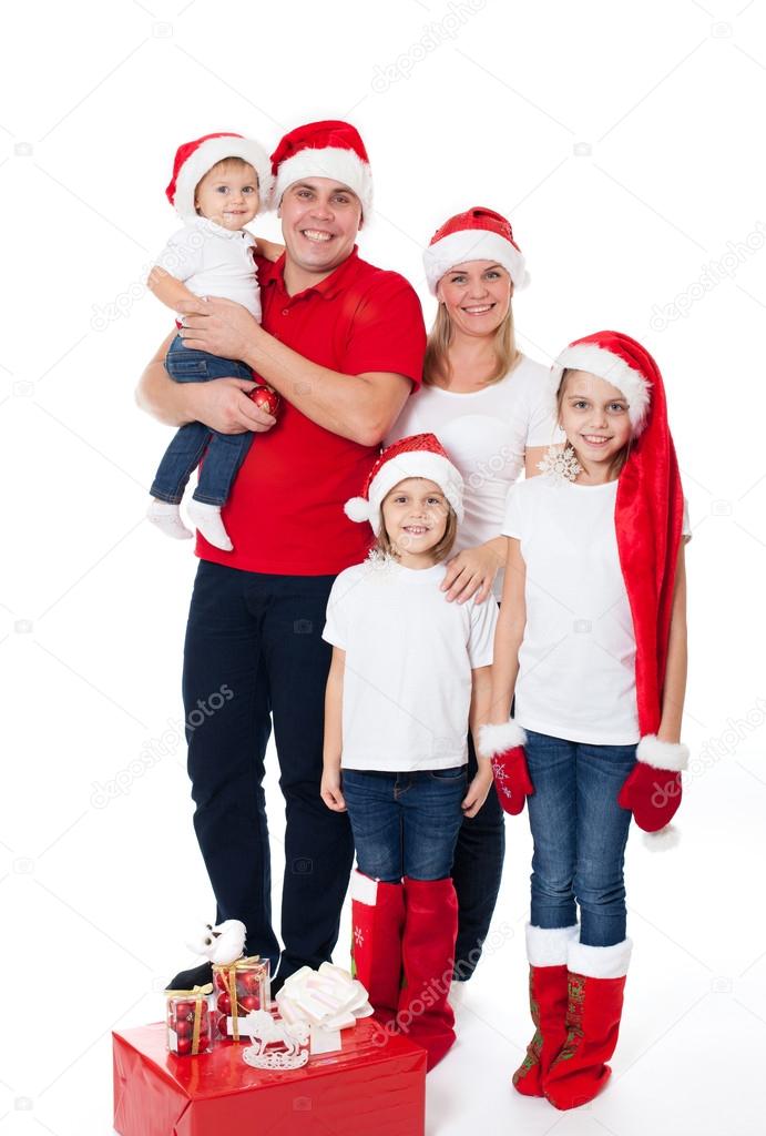 Happy cute family in santa's hats