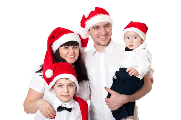 Happy cute family in santa's hats — Stock Photo, Image