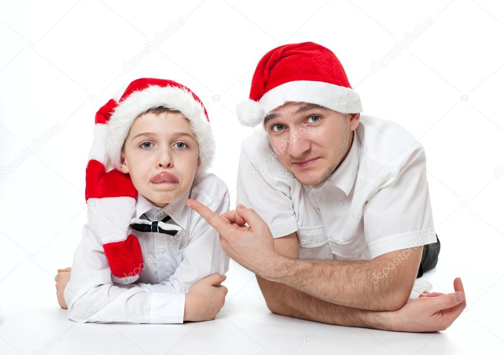 father and son in Santa's hats