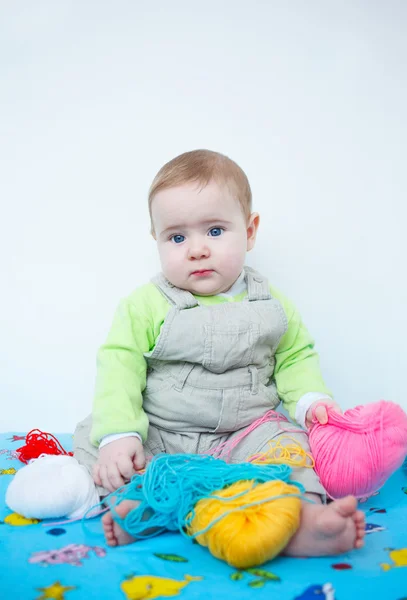 Cute baby playing with knitting — Stock Photo, Image