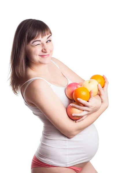 Mujer embarazada con guiño de frutas — Foto de Stock