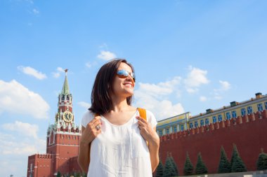 Happy girl tourist on Red Square in Moscow Russia