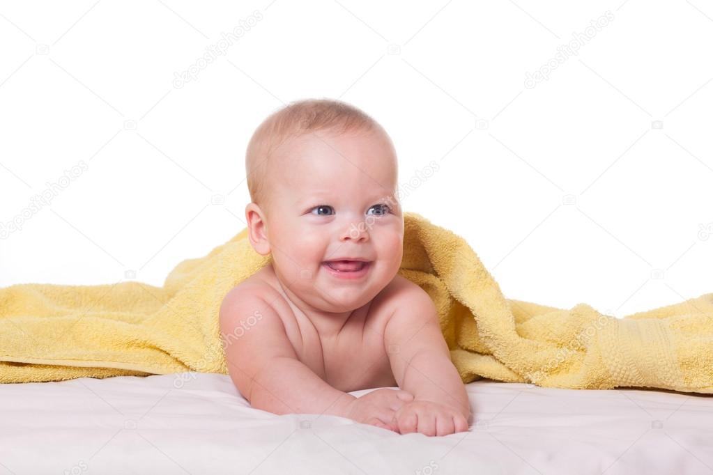 Cute happy baby in towel