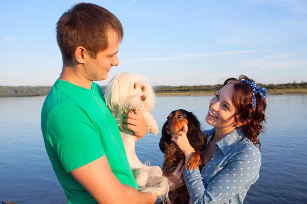 couple with their dogs