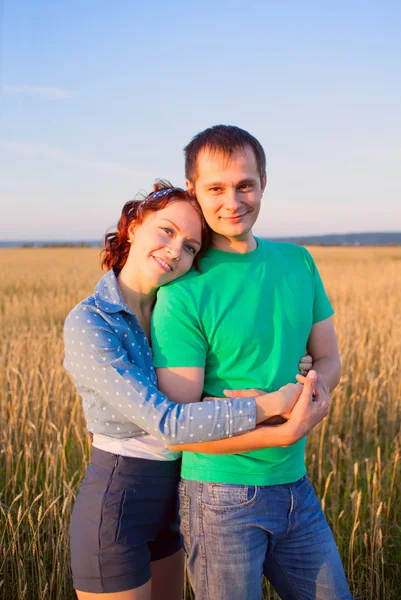 Happy couple in love in the field Stock Image
