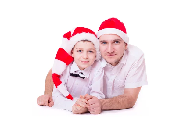Pai e filho em chapéus de Papai Noel — Fotografia de Stock