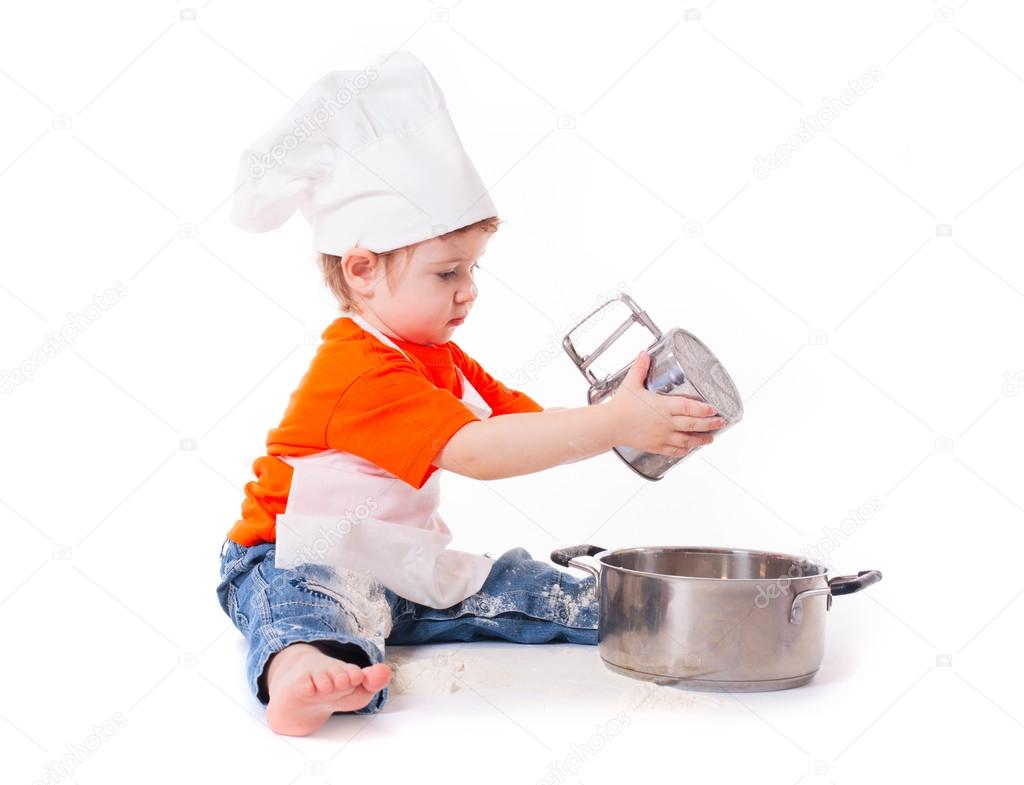 baby chef sifting flour isolated on white background