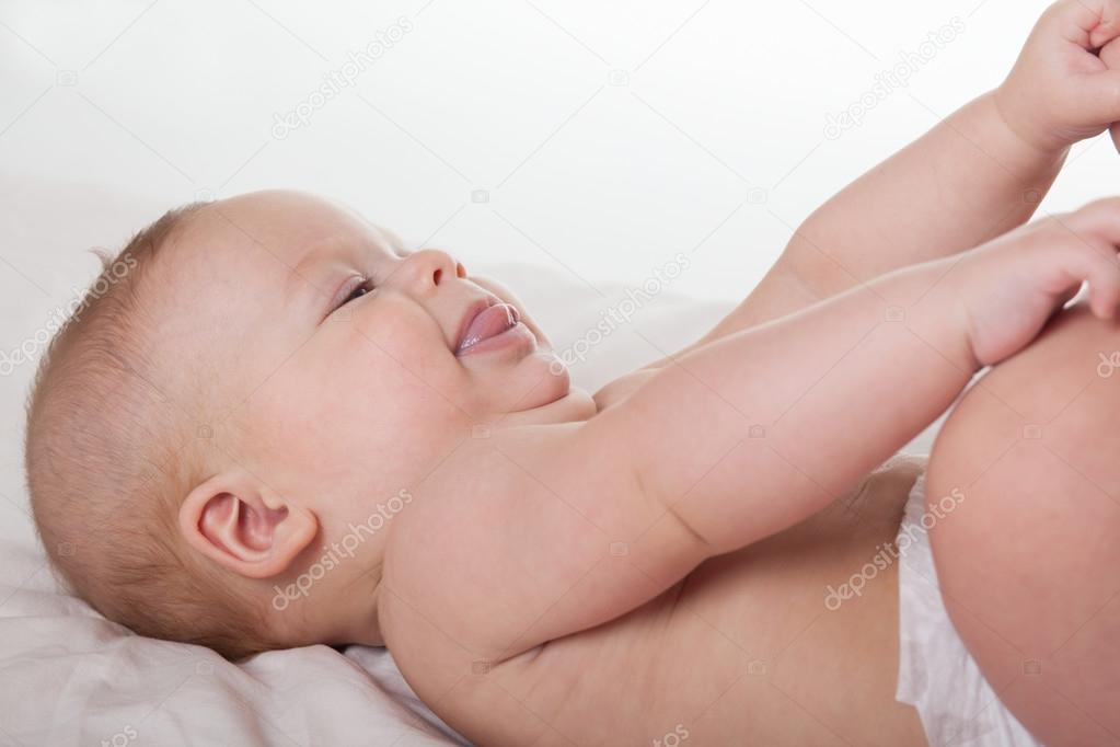 Cute happy baby in diaper
