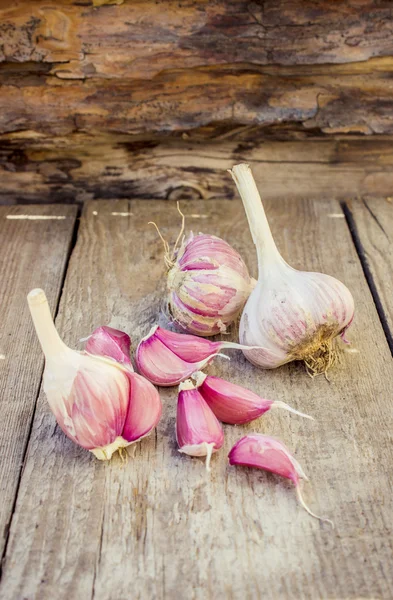 Rustic style Garlic (peeled) on vintage wooden background — Stock Photo, Image